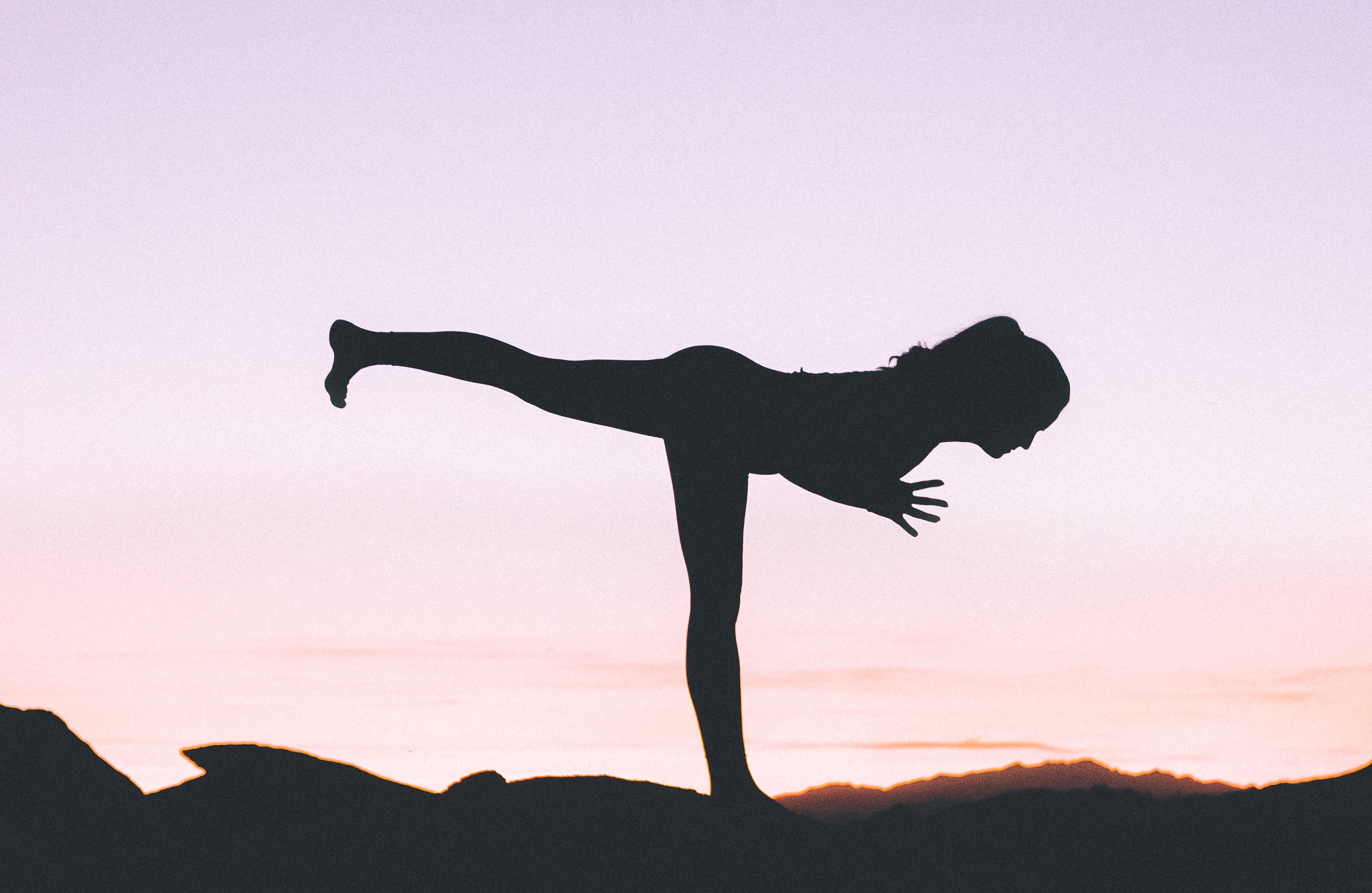 woman in warrior 3 asana